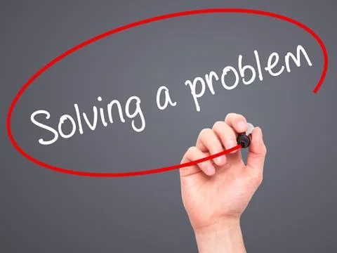 Man Hand writing Solving a problem with black marker on visual screen Foto stock