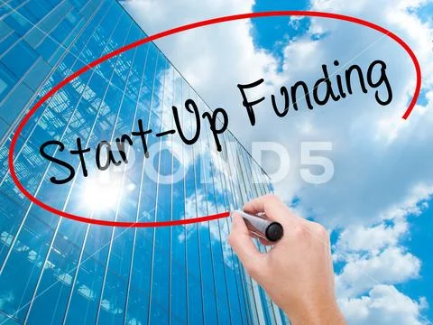 Man Hand writing Start-Up Funding with black marker on visual sc Stock Photos
