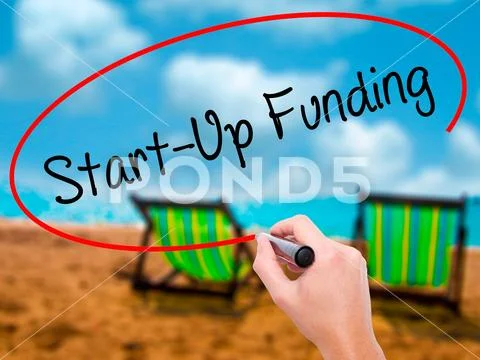 Man Hand writing Start-Up Funding with black marker on visual sc Stock Photos