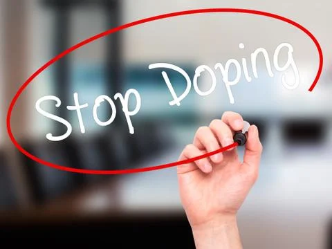 Man Hand writing Stop Doping with black marker on visual screen 写真素材