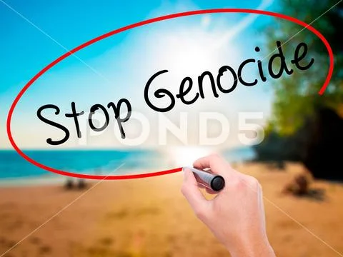 Man Hand writing Stop Genocide with black marker on visual scree Stock Photos