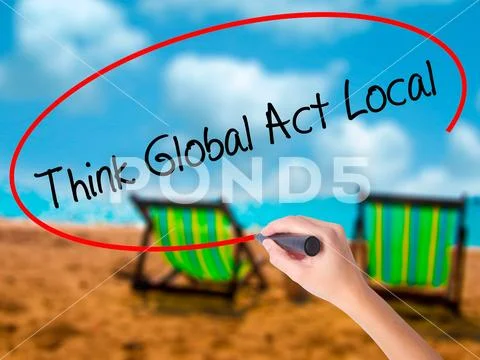 Man Hand writing Think Global Act Local with black marker on vis Stock Photos
