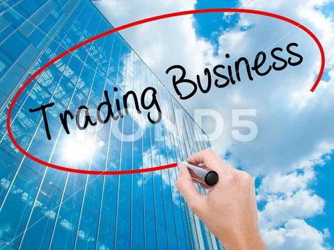 Man Hand writing Trading Business with black marker on visual sc Stock Photos
