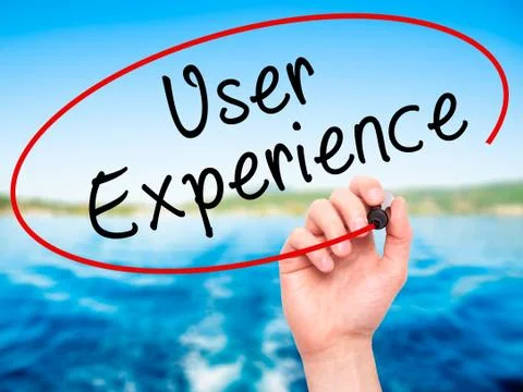 Man Hand writing User Experience with black marker on visual screen Stock Photos