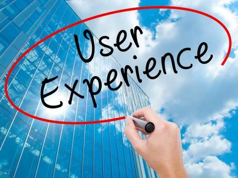 Man Hand writing User Experience with black marker on visual screen Stock Photos