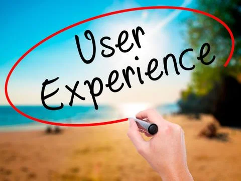 Man Hand writing User Experience with black marker on visual scr Stock Photos