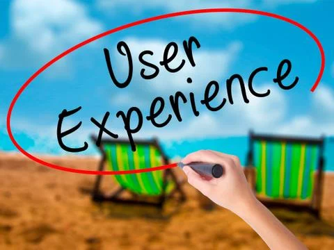 Man Hand writing User Experience with black marker on visual scr Stock Photos