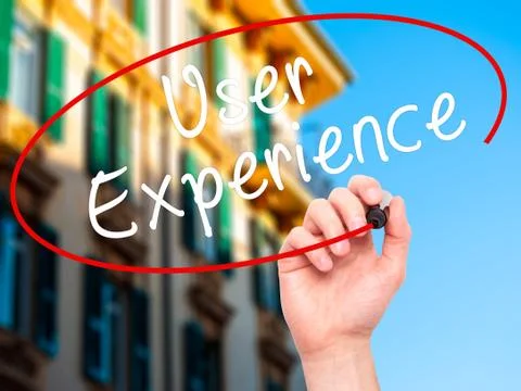 Man Hand writing User Experience with black marker on visual scr Stock Photos