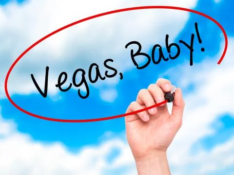 Man Hand writing Vegas, Baby! with black marker on visual screen Stock Photos