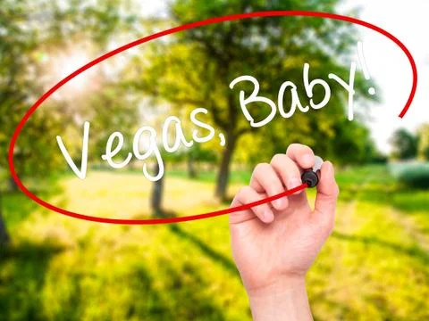 Man Hand writing Vegas, Baby! with black marker on visual screen Stock Photos
