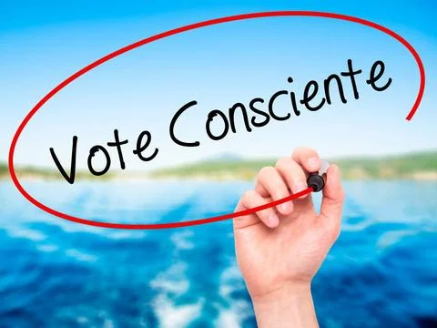 Man Hand writing Vote Consciente (Vote conscientiously In Portuguese) with... Stock Photos