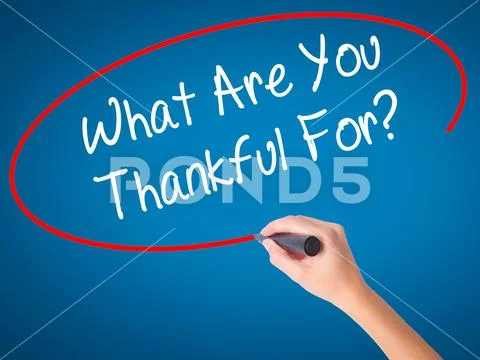 Man Hand writing What Are You Thankful For? with black marker on Stock Photos