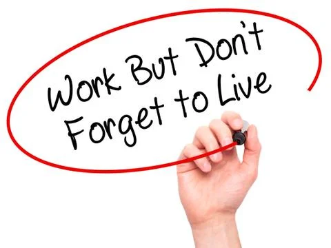 Man Hand writing Work But Don't Forget to Live  with black marker on visual.. Stock-Fotos