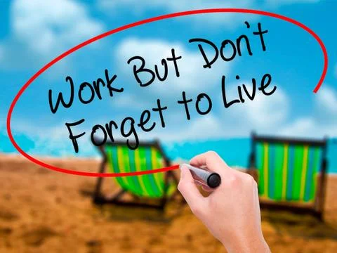 Man Hand writing Work But Don't Forget to Live  with black marke Stock-Fotos
