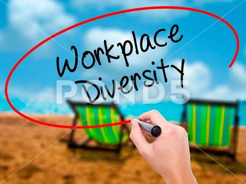 Man Hand writing Workplace Diversity with black marker on visua Stock Photos