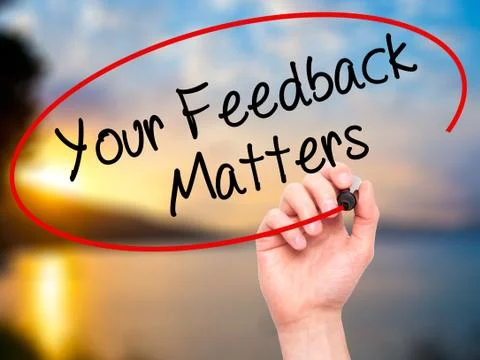 Man Hand writing Your Feedback Matters with black marker on visual screen Foto stock