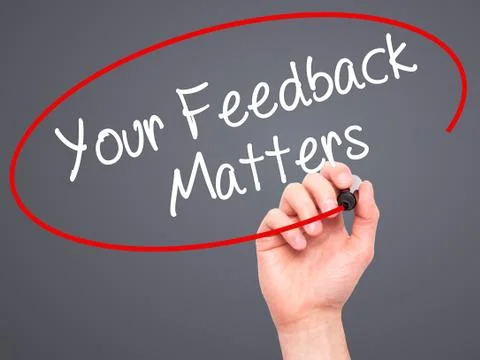 Man Hand writing Your Feedback Matters with black marker on visual screen Stock Photos