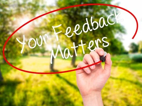 Man Hand writing Your Feedback Matters with black marker on visual screen Stock Photos