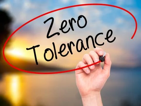 Man Hand writing Zero Tolerance with black marker on visual screen Foto stock
