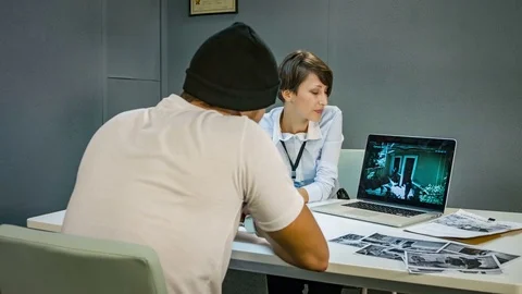 Man in handcuffs looking robbery recorded on camera, cctv. interrogation room 스톡 동영상 69954006