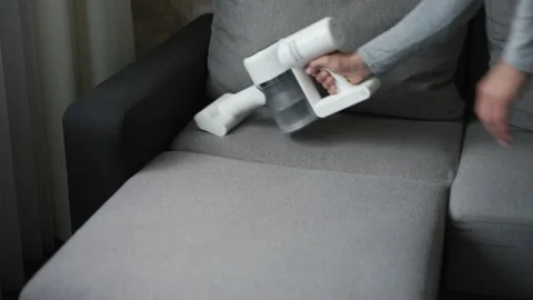 Man with handheld vacuum cleaner Stock-Footage 155989498