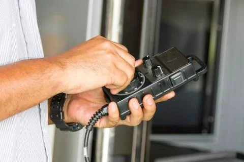 Man of handle on remote CNC control Stock Photos