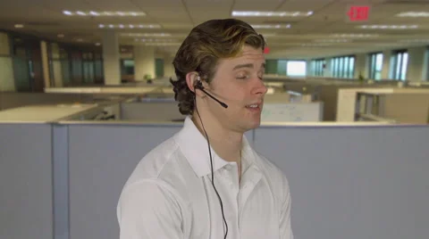 Man handles customer call at work Stock Footage 64862710