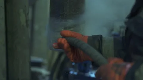 Man handles a steam pipe thread on a drilling rig Stock Footage 143328504