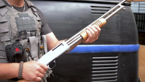 Man handling weapon Stock Footage 167088048