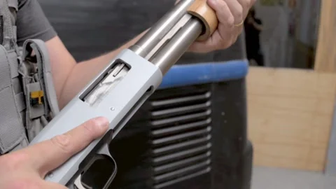 Man handling weapon Stock Footage 167088054