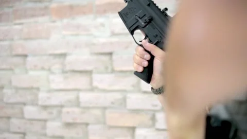 Man handling weapon Stock Footage 167088061