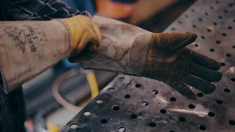 Man hands adjust gloves slow motion shallow depth of field Видео 104078961