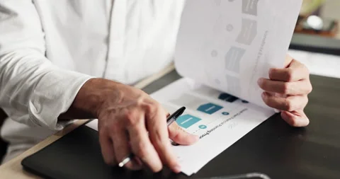 Man, hands and reading with documents for analytics, company performance or Stock Footage 329404399