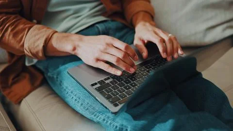Man, hands and remote work in home with laptop, browse internet and editing.. Stock Photos