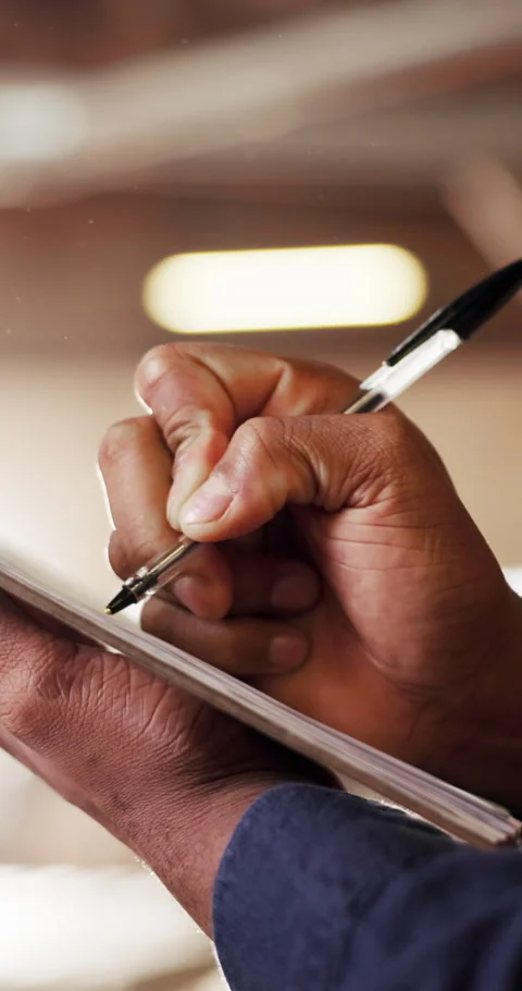 Man, hands and writing in warehouse with clipboard, manufacturing inspection and Stock Footage 340759077