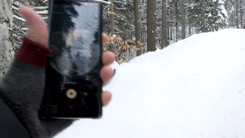 Man hands are bringing a smartphone in the frame where an 360 video app is Stock Footage 87842832