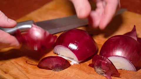 Man hands are peeling red onion, close up Stock Footage 248530568