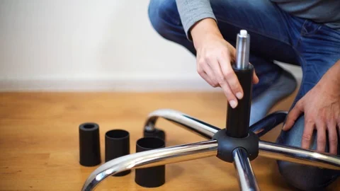 Man hands assembling office chair Stock-Footage 99009356
