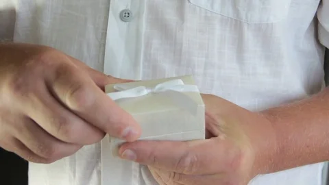 Man hands box with ring Stock Footage 79872394