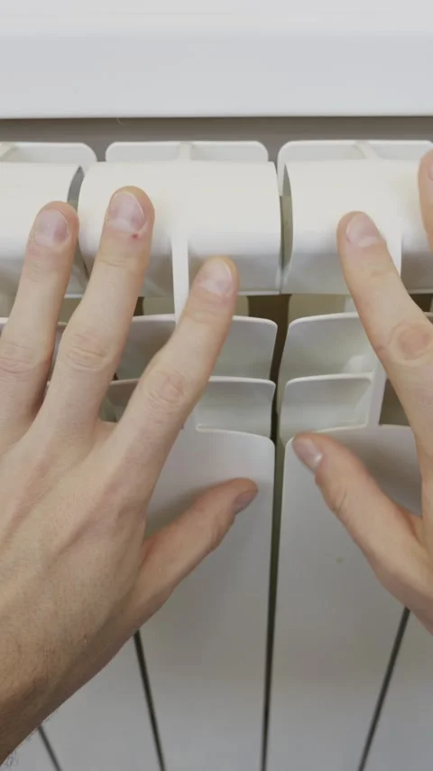 Man Hands Checking Temperature on a White Central Heating Radiator Stock Footage 329403043