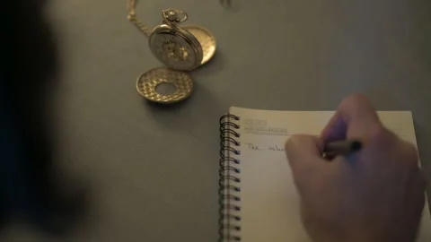 Man hands close up writing notes golden pocket watch Stock Footage 246254820