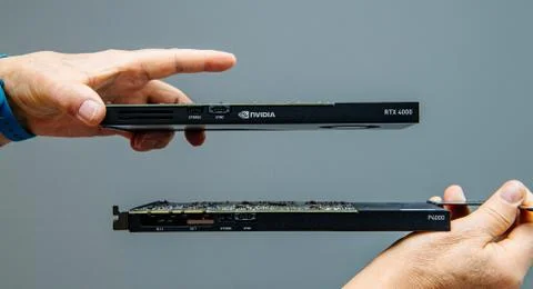 Man hands comparing latest Nvidia Quadro professional GPU video card RTX 4000 Foto stock