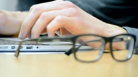 Man hands, computer and glasses on the table. Stock Footage 71123791