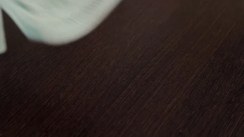 Man hands to count the dollars on wooden table Video stock 108049375