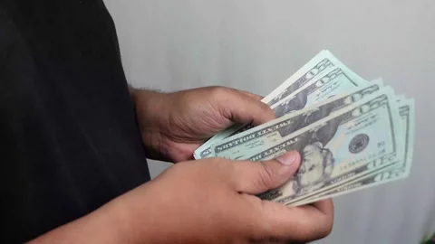 Man hands counting Dollar banknotes 動画素材 289387157