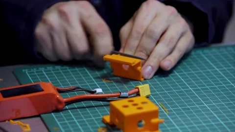 Man Hands Cut Plastic Drone Battery Detail Closeup Stock Footage 117210281