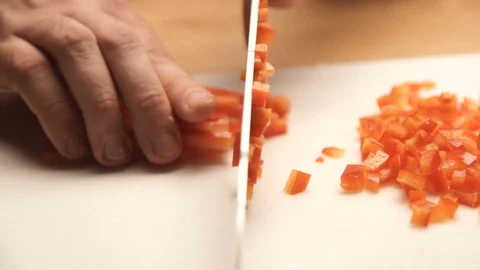 Man hands cut into red peppers on a cutting board. The concept of a healthy diet Stock Footage 73274550