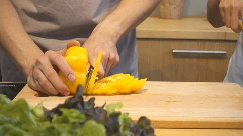 Man hands cutting bell pepper in the kitchen. Stock Footage 90623717