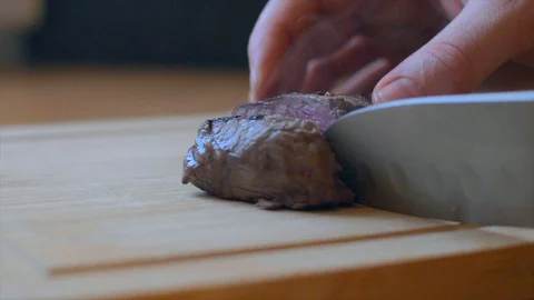 Man hands cutting veal medium Stock Footage 102985036