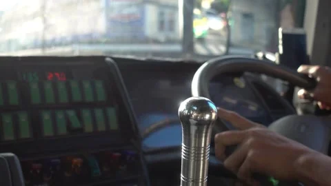 Man hands driver on steering wheel of a modern car on with street background. Stock-Footage 336267891